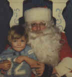 tj and santa.jpg (59257 bytes)